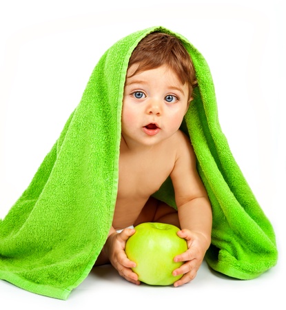 a cute little boy eating big fresh apple, adorable child covered green towel isolated on white background, closeup portrait of cheerful kid enjoying healthy nutrition, health care concept

の写真素材