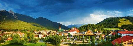 Little town in the mountains, Europe, Austria, Seefeld, Alps, dark blue sky, beautiful buildings, traditional architecture, summer vacation conceptの写真素材