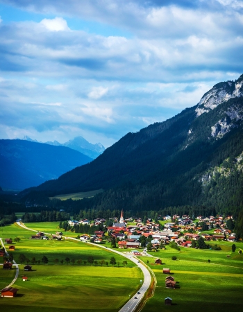 Little village in the mountains, beautiful mountainous landscape, many cozy houses, luxury ski resort, active holidays and vacation concept
の写真素材