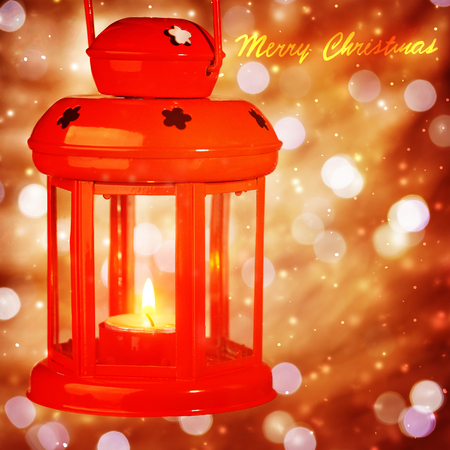 Beautiful red Christmas lantern hanging on blurry background, greeting card, luxury vintage decoration for New Year eveの写真素材