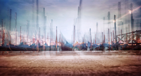 Photo with soft focus of moored Venetian gondolas, creative fine art  grunge style photo, slow motion of traditional Venice city transport, Italyの写真素材