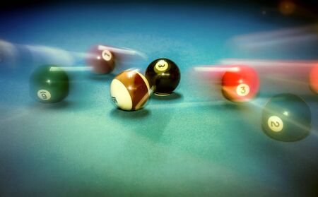 Billiard table vintage background, playing game in night club, slow motion technique, soft focus effect, hobby and sport conceptの写真素材