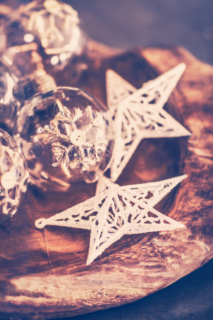 Vintage Christmas decorations, beautiful stylish Christmas tree baubles, retro style photo of a white stars and transparent balls, winter holidays greeting card
の写真素材
