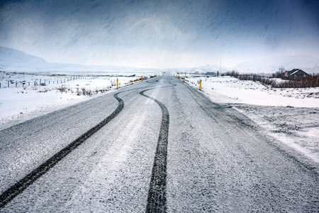 Empty snowy highway, beautiful wintertime landscape, amazing panoramic view, cold weather in Iceland, Scandinavia

の写真素材