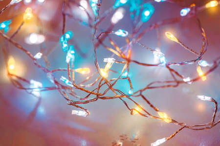 Christmas lights background, colorful garland, beautiful electric festoon, traditional festive decoration, holiday greeting card, happy New Yearの写真素材