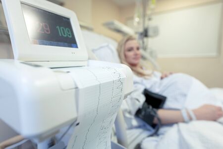 Pregnant woman in the hospital, measuring a blood pressure, preparation to childbirth, healthy...