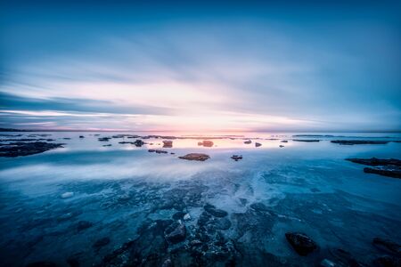 Beautiful sea landscape, amazing view on sunset over Mediterranean sea, wild stony beach shore,...