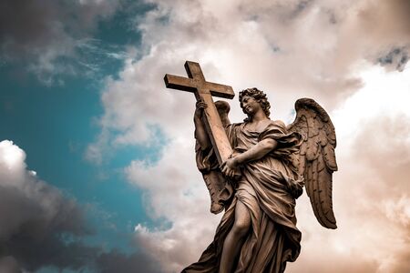 Angel under cloudy blue skyの写真素材