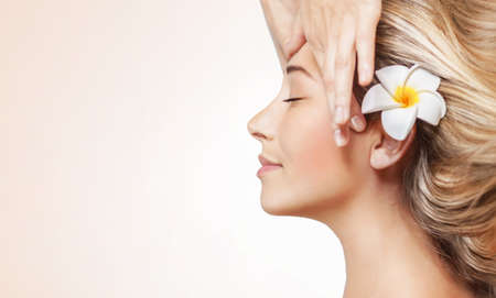 Female Enjoying Spa. Getting Face Massage at Beauty Clinic. Woman with Perfect Skin.の写真素材