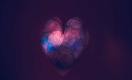 Conceptual Image of Love. Dark Purple Bokeh Style Heart. Abstract Holiday Background. Happy Valentines Day. Greeting Card for Lovers.の写真素材