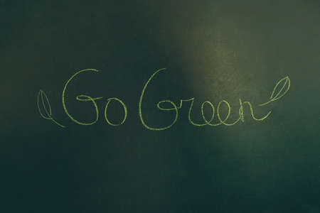 Conceptual Photo of an Environmental Protection. Green Background with Written Words. Go Green. Save the Planet Earth.の写真素材