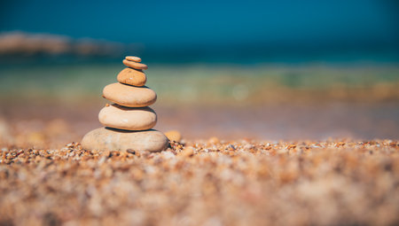 Pile of Pebbles over Beautiful Beach Background. Seashore of a Beach Resort. Peaceful Summer...