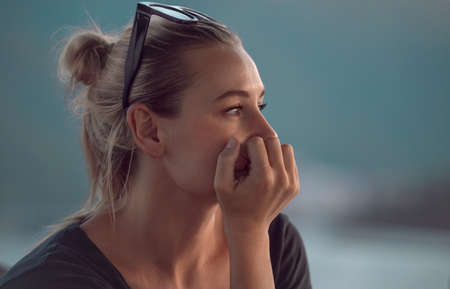Closeup Portrait of a Genuine Woman Thinking about Life. Authentic Beauty of a Young Female. Peaceful Calm Vacation.の写真素材