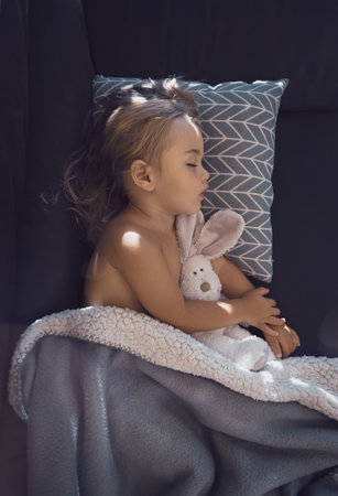 Beautiful baby sleeping at homeの写真素材