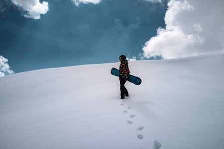 Girl snowboarder enjoys winter sport
