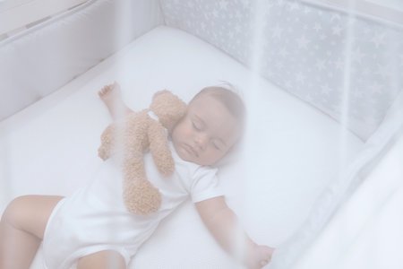 Adorable child sleeping with soft toyの写真素材