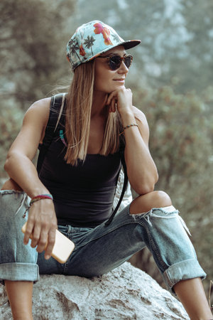 Pretty woman sitting in the parkの写真素材