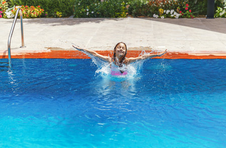 Happy girl in the pool