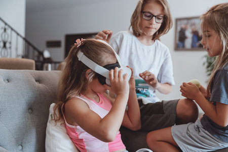 Happy Siblings Playing Video Gamesの写真素材