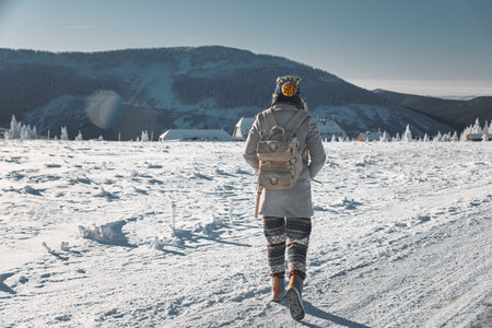 Female Enjoying a Solitary Walk Through the Snowy Landscape
