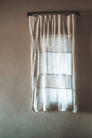 Vintage Curtain with Calm Neutral Wall Backgroundの写真素材