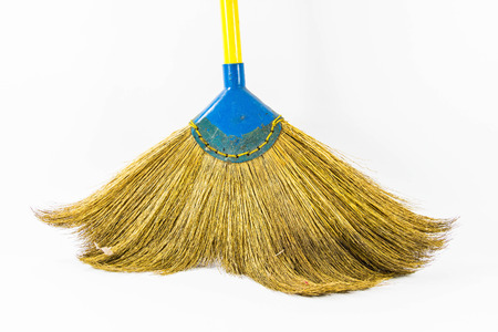 Yellow handled broom on a whiteの写真素材