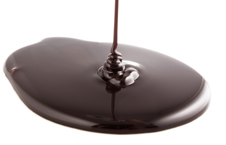Chocolate flow on the whiteの写真素材