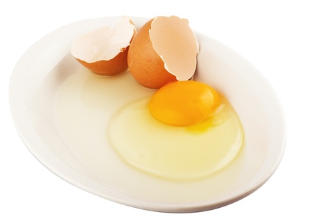 Raw egg tear into half with yolk and albumin