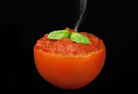 Sauce smoking on the black backgroundの写真素材