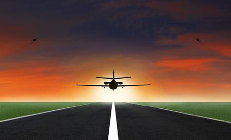 Airplane on the sunset background