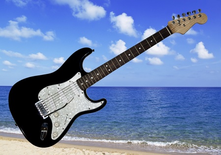 Beautiful blue and white electric guitar on the sea backgroundの写真素材