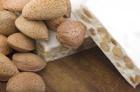 Nougat with almonds on the woodの写真素材