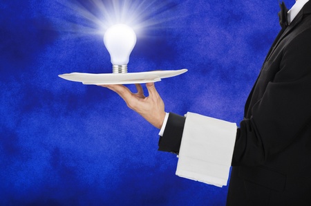 young waiter in work uniformon have ideaの写真素材