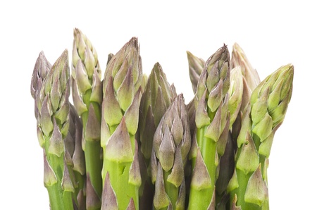 bunch of fresh asparagus close up on white の写真素材
