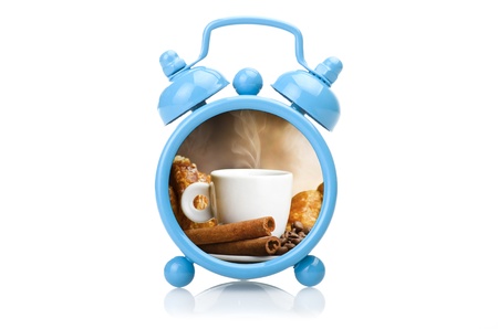 Old blue alarm clock concept close up on white 