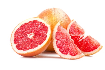 Pink grapefruit close up on the white の写真素材
