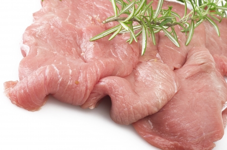Veal meat and rosemary close up on white の写真素材