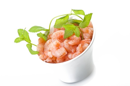 Shrimps with mint leaves close up on white の写真素材