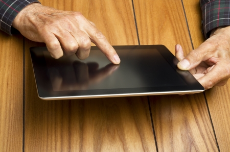 The grandfather use the tablet in relaxの写真素材