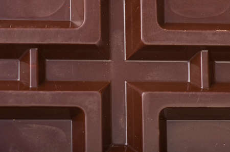 Closeup detail of chocolate parts on white background 