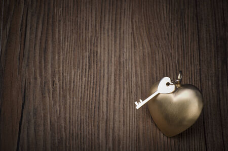 Old key and gold heart  Key of my heart concept  Valentineの写真素材