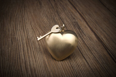 Old key and gold heart  Key of my heart concept  Valentineの写真素材