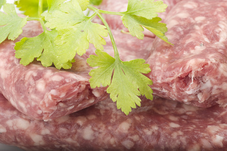 sausage with parsley leaves on the whiteの写真素材