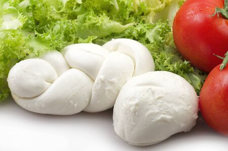 Mozzarella tomatoes and fresh salad on the whiteの写真素材