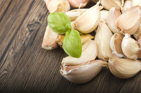 Group of garlic cloves on the woodの写真素材