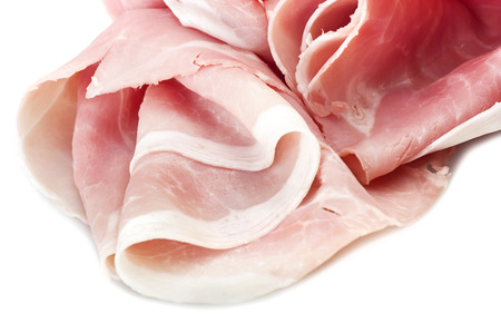 Italian pork ham slices on white backgroundの写真素材