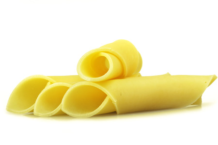 Swiss cheese slices close up on the whiteの写真素材