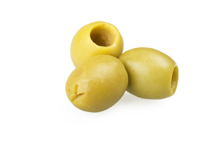 Pitted green olives close up on the whiteの写真素材