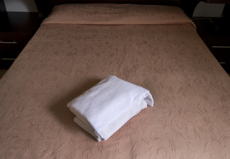 clean linen on the bed in the hotel 1の写真素材