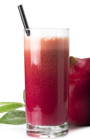 a glass of pomegranate juice on white backgroundの写真素材